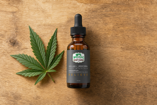 WHF Relieve CBD tincture bottle beside a hemp leaf on a natural wood surface